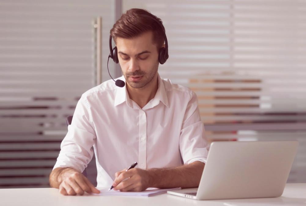 Modern workspace showing investment platform running on multiple devices including desktop monitor and tablet